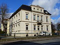 Tenement house with fencing, in a corner and open development