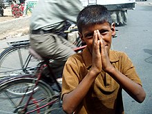 A boy begging in India. Not My Life depicts many different kinds of contemporary slavery, including forced child begging. Boy begging in Agra.jpg