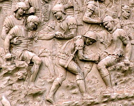 Capsarii depicted tending to injured soldiers on Trajan's Column