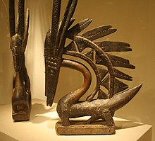 Two Bambara Chiwara c. late 19th / early 20th centuries. Female (left) and male Vertical styles. Chiwara Chicago sculpture.jpg