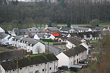 1950s council housing in Sorn; the brown building in the centre rear with the cream tower is the primary school Council Housing, Sorn, East Ayrshire.jpg