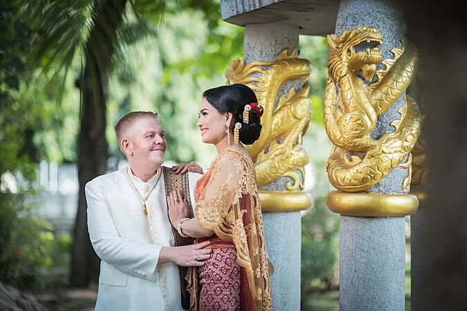 A couple at a pre-wedding ceremony in Thailand