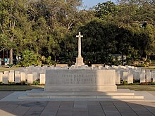 The Stone of Remembrance visible in the foreground as well as the Cross of Sacrifice in the background. Delhi War Cemetery Front View.jpg