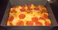 Detroit-style pizza in a traditional-style pan