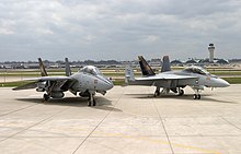 An F-14B and F/A-18F from VFA-11 (formerly VF-11) Red Rippers. The squadron transitioned to Super Hornets in 2005 F-14B and FA-18EF VF-VFA-11 Parked 2 - 2005.jpg
