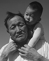 Grandfather and grandson at Manzanar, July 2, 1942 Face detail, Manzanar Relocation Center, Manzanar, California. Grandfather and grandson of Japanese ancestry at . . . - NARA - 537994 (cropped).jpg