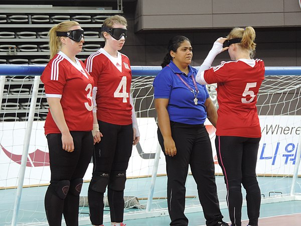 #5 Anna Sharkey having eyeshades inspected, watched by #4 Georgina Bullen and #3, at the IBSA World Games, Seoul, South Korea (May 2015).
