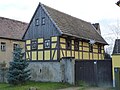 Residential stable house, barn and side building of a three-sided courtyard