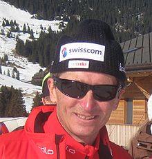 Photo d'Hippolyt Kempf portant des lunettes de soleil et un bonnet