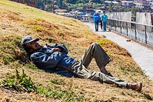 Man napping in San Cristobal, Peru Hombre echando una siesta en San Cristobal, Cusco, Peru, 2015-07-31, DD 49.JPG