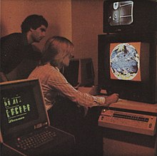 Employees at the Hughes Aircraft Company observing an image on a Comtal image processor, circa 1979 Hughes Aircraft Company employees behind graphics display.jpg