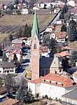 Parish church Maria Himmelfahrt with tower, cemetery chapel and cemetery