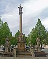 Column with a trinity sculpture