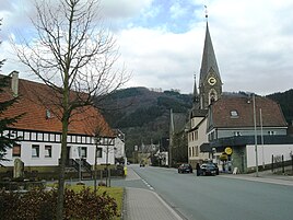 Passage through the village with St. Anna and Castle