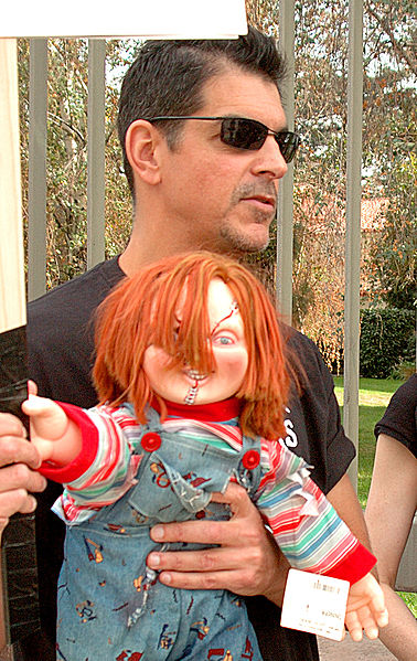 Don Mancini during the 2007–08 Writers Guild of America strike, holding a Chucky doll.