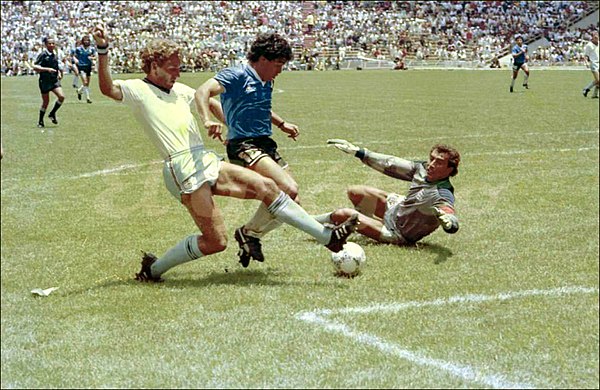 Shilton watches as Maradona rounds him to score his second goal of the match, deemed "The Goal of the Century"