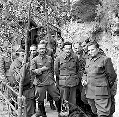 Kocbek (third from the right, in the back) with Marshall Tito (first from the right) and a group of Yugoslav Communist resistance leaders in Drvar cave Bosnia in 1944.