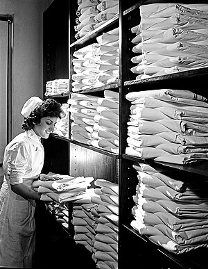 Nurse in Hospital Linen Closet, Pepperell Manufacturing Company (11179260584).jpg