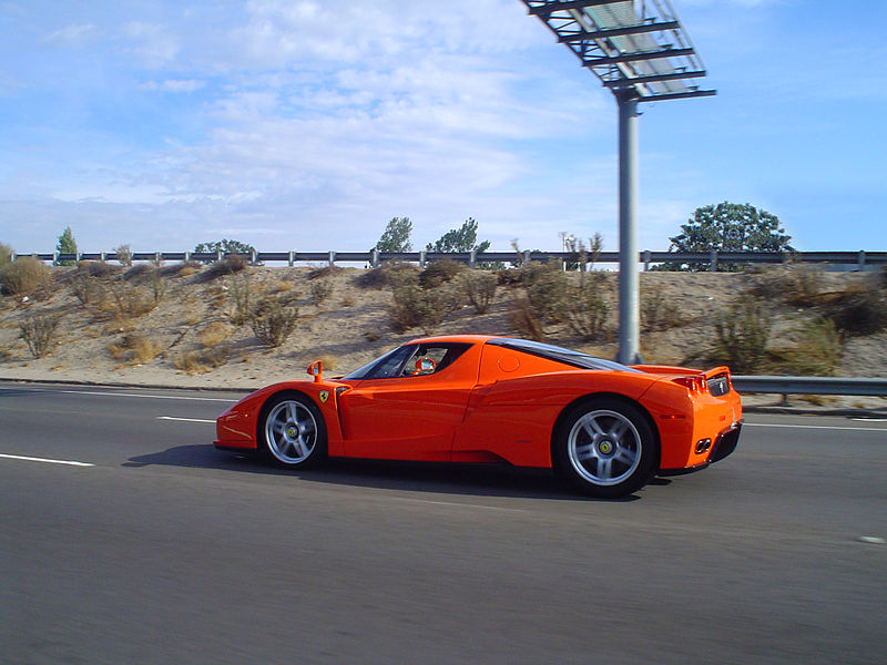 File:Orange ferrari enzo driving (2992812856).jpg