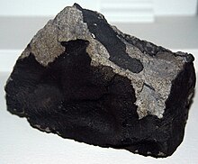 Ochansk Meteorite, an ordinary chondrite with a fusion crust, found in 1887 in Russia. Ordinary chondrite (Ochansk Meteorite).jpg