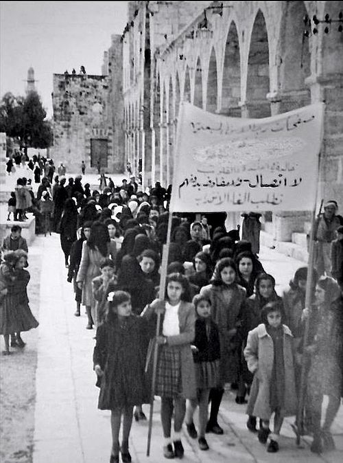 A 1930 protest in Jerusalem against the British Mandate by Palestinian women. The sign reads "No dialogue, no negotiations until termination [of the M