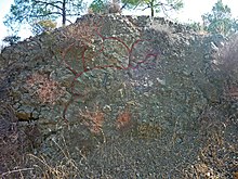 Pillow lava of the Troodos ophiolite (The red lines have been added to the photo by the photographer to outline the shape of some of the lava pillows) Pillow Lava of Troodos Ophiolite in Cyprus.jpg