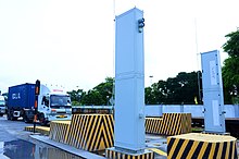 A Radiation Portal Monitor scanning trucks at a security checkpoint. Radiation Portal Monitor.jpg