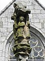 Fontaine-calvaire. Détail. Saint-Jean au pied du Christ en Croix.