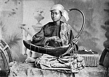 Saung musician in 1900 Saung harp musician.jpg