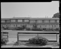 Sectional view of north elevation of Building No. 35, seen from yard of Building No. 37. Foothill Avenue in middle ground. Looking south - Easter Hill Village, Building No. 35, HABS CA-2783-AB-3.tif