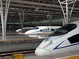 English: Chinese High Speed train CRH2 and CRH380B in Shanghai-Hongqiao station Deutsch: Chinesischer Hochgeschwindigkeitszug CRH2 und CRH380B im Bahnhof Shanghai-Hongqiao