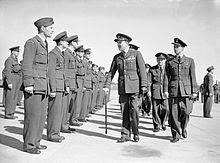 Farewell parade of Czechoslovak squadrons at RAF Manston, Kent, on 3 August 1945. Air Marshal John Slessor, with walking stick, inspects some of the men. Air Marshal Karel Janousek can be seen behind him. Slessor inspects Czecho-Slovak personnel.jpg