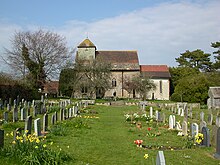 Seen from the south side across the churchyard, the belfry and modern vestry are visible on the left. St John the Baptist's Church, Clayton, West Sussex - Churchyard and South Side.JPG