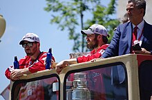 Leonsis (right) with Brooks Orpik and Alexander Ovechkin during the 2018 Stanley Cup championship parade Stanley Cup Parade (42853179431).jpg