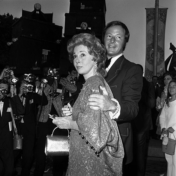 Susan Hayward and Jay Bernstein arriving at a MPTF event in 1971