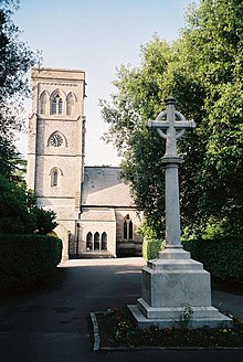 The parish war memorial in front of the tower of St Mark's church in the background, pictured in 1998. Talbot Village, parish church of St. Mark - geograph.org.uk - 486174.jpg