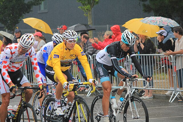 Hushovd (in yellow) at the 2011 Tour de France. Hushovd held the overall lead of the race from the second to the ninth stage of the race.