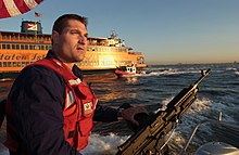 United States Navy and Coast Guard providing security during the convention US Navy 040901-C-7087B-001 Petty Officer 3rd Class Maurice Orlando, from San Diego, Calif., keeps a sharp eye on boat traffic while security boats from Coast Guard Maritime Safety and Security Team 91106 escort Staten Island fe.jpg