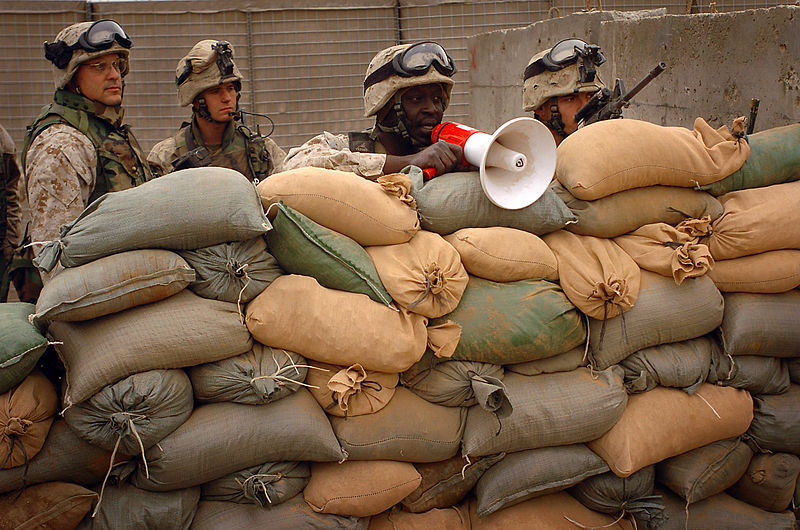 File:US Navy 050220-N-6967M-352 U.S. Navy Chaplain Lt. Marc Diconti, left, watches as Marines and a translator, assigned to 1st Marine Division, 2nd Battalion, 5th Marines, direct civilians through one of the many checkpoints in Ram.jpg