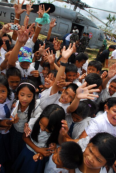 File:US Navy 080701-N-0640K-305 Residents from the Municipality of Balasan, Philippines wave and cheer after Sailors assigned to the.jpg