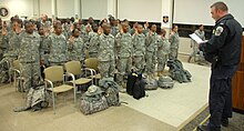 An MPDC officer deputizing members of the Virgin Islands National Guard who have just landed at Andrews Air Force Base for the second inauguration of Barack Obama. Virgin Islands National Guard.jpg