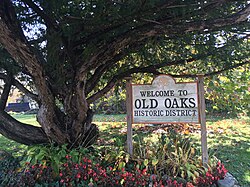 A welcome sign to the Old Oaks Historic District