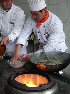 Wok cooking and the heat source by The Pocket in Nanjing.jpg
