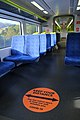 'Keep Your Distance' COVID-19 sign in Wellington commuter train carriage.jpg