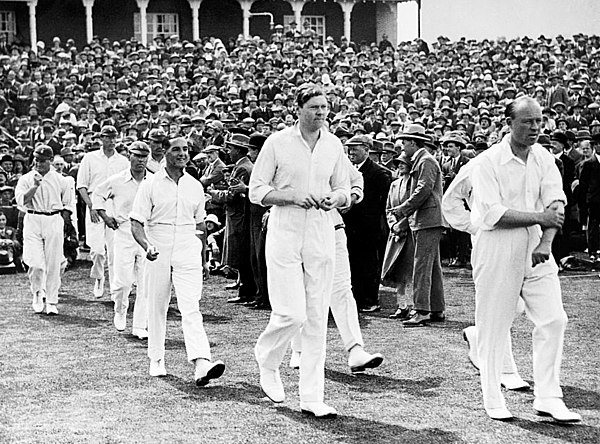 Carr (right) and Chapman leading the England team to the third Test against Australia at Headingley in 1926.