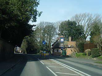 The A413 at Whitchurch in Buckinghamshire: The Firs is located behind the high stone wall on the left A413 at The White Swan, Whitchurch - geograph.org.uk - 4871839.jpg