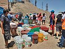 Abasteciendo de agua potable en los cerros de San Martín de Porres en el Estado de Emergencia Covid-19.jpg