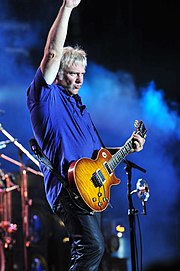 Lifeson playing his Gibson Les Paul in the 'Heritage Cherry Sunburst'. This guitar has been modified to incorporate a Floyd Rose tremolo.