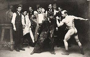 Rex Slinkard arm-wrestling with model Al Treloar at the Art Students League of Los Angeles, c.1912 Art students posing with an artists' model, ca.1912.jpg