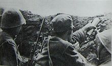 Communist soldiers wait in trenches during the Campaign to Defend Siping, 1946. Battle of Siping01.jpg